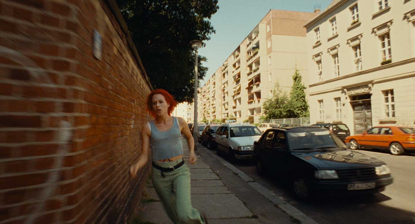 Lola running toward camera on Linienstraße